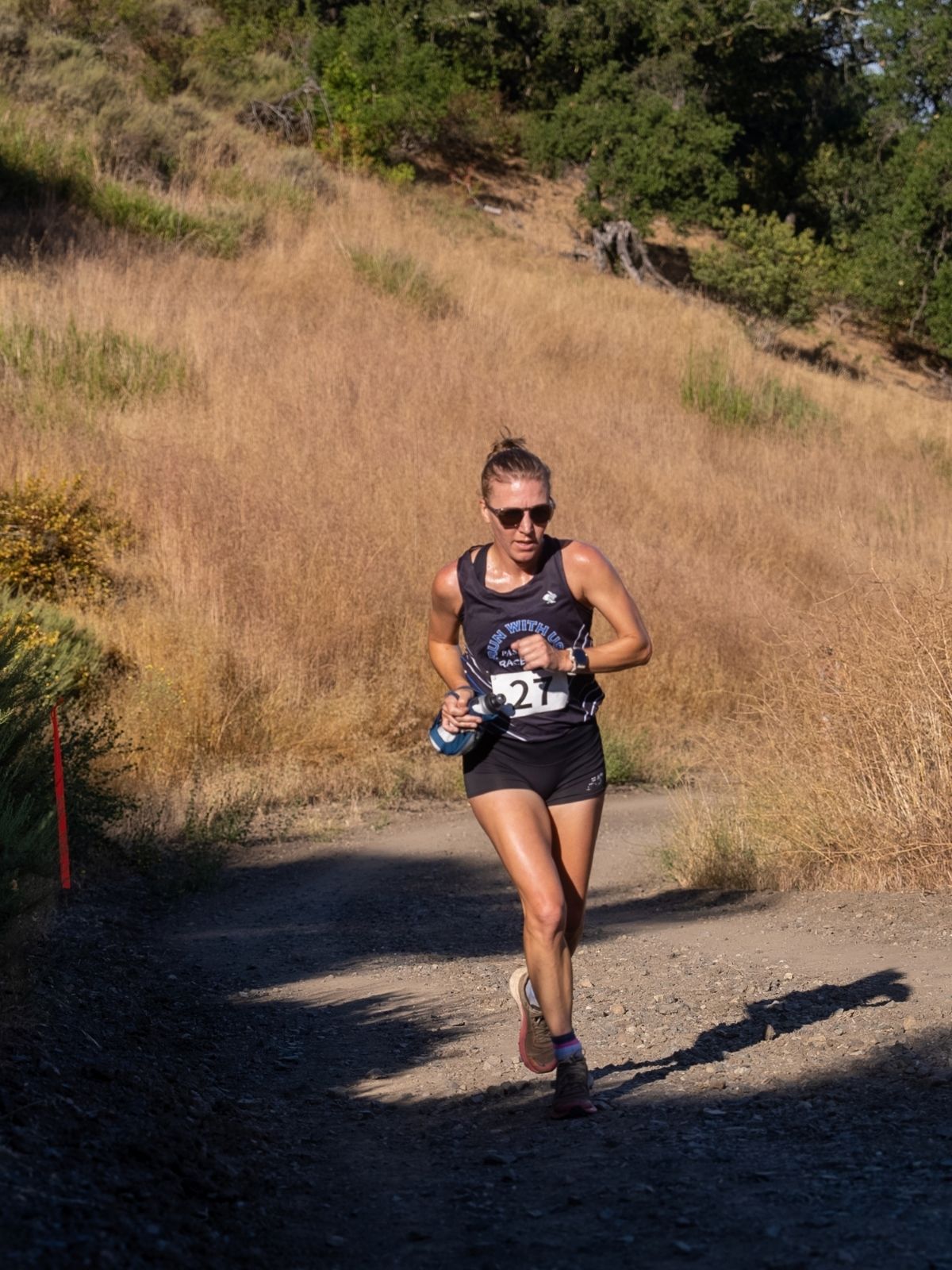 Kate Olson racing on a trail